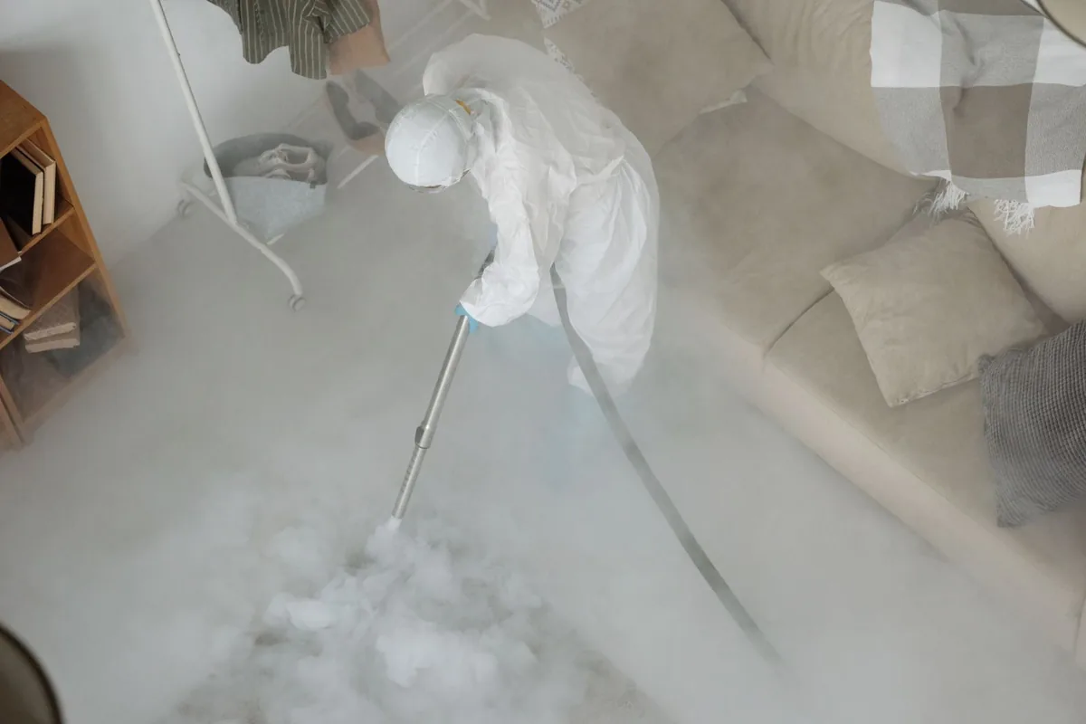 Biohazard cleanup technician in protective equipment, Wilbraham, MA